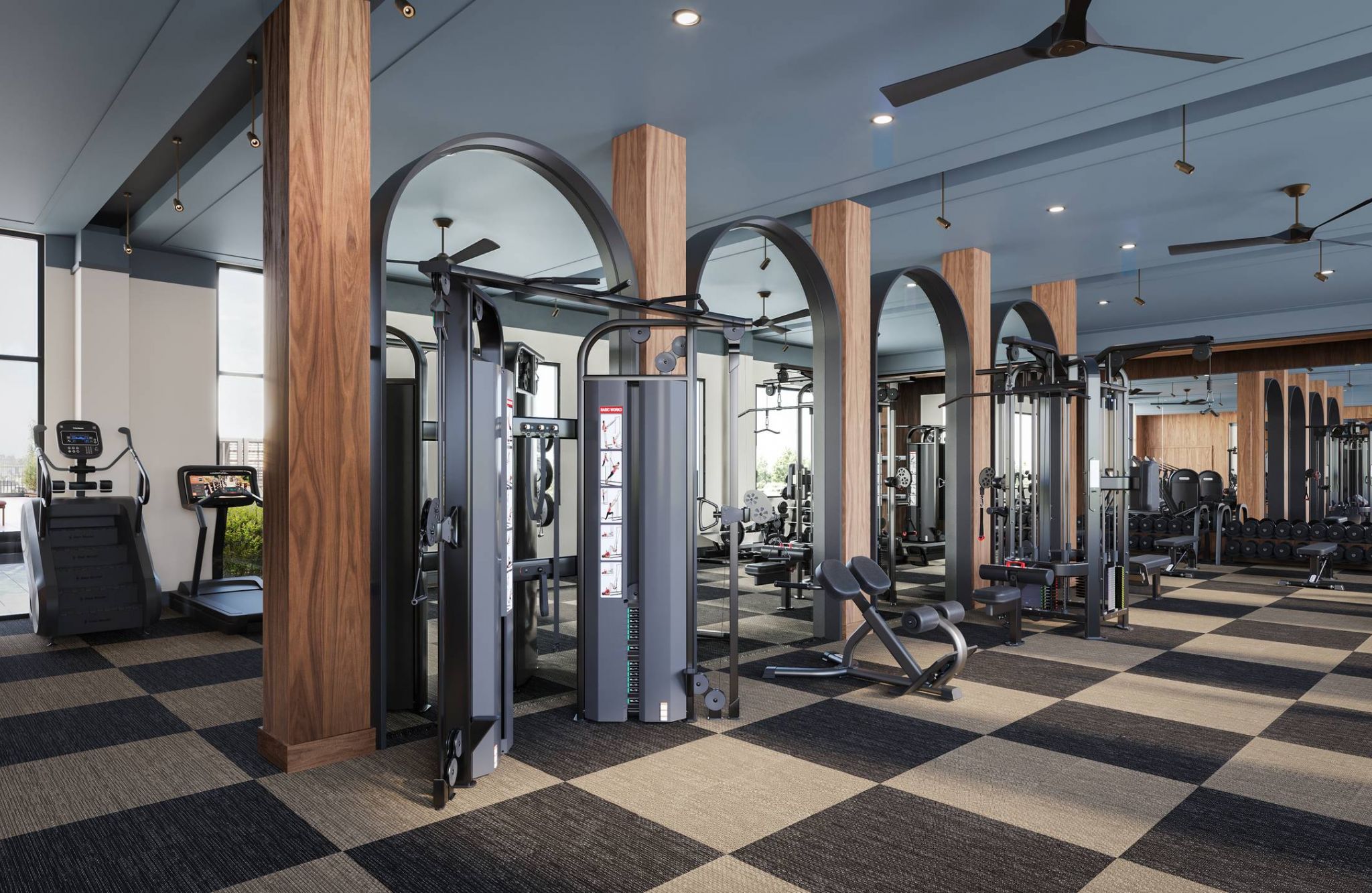 Ever College Station student living apartments Modern gym with various exercise machines, free weights, large windows, and wooden arches on a checkered floor.
