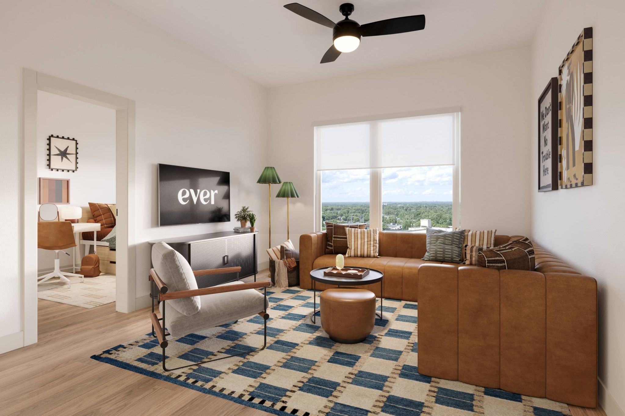 Ever College Station student living apartments Modern living room with tan sofa, patterned rug, armchair, TV, and large window with city view.