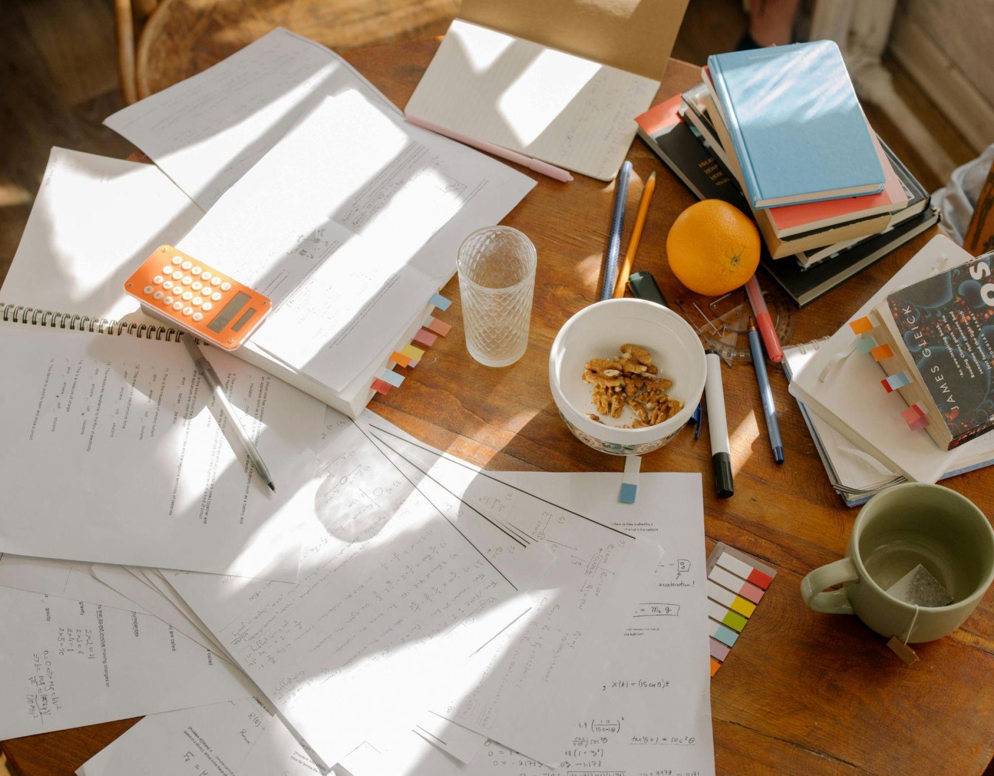 Student study desk with notebooks, calculator, and coffee showcasing focused study space at EVER College Station