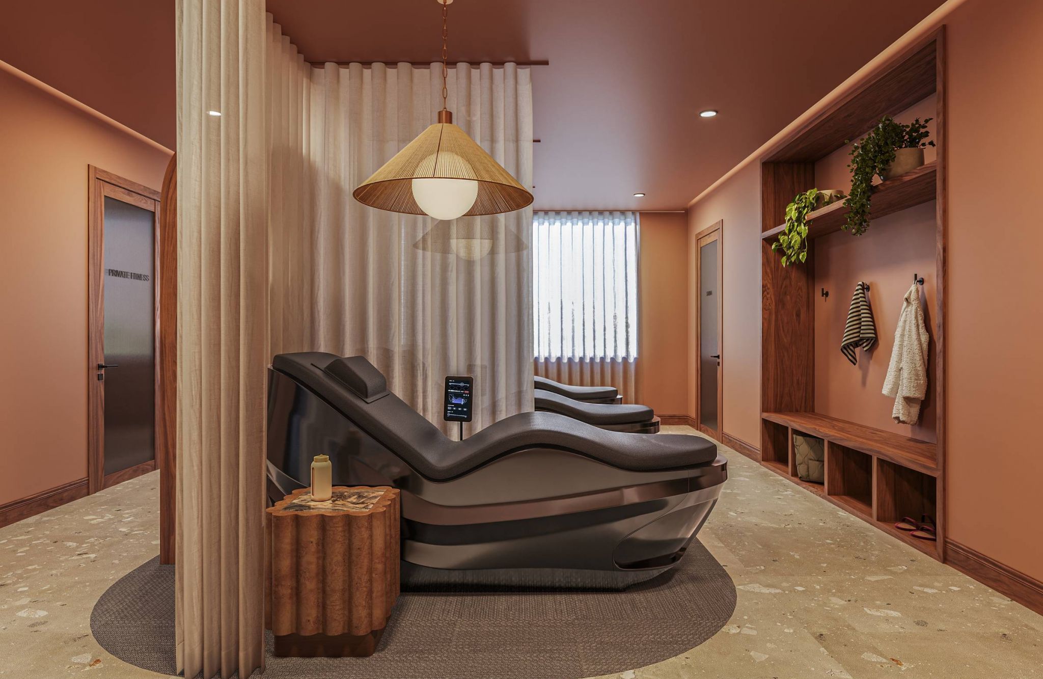 Ever College Station student living apartments Two modern lounge chairs in a warm-toned spa room with soft lighting, plants, and wooden decor elements.