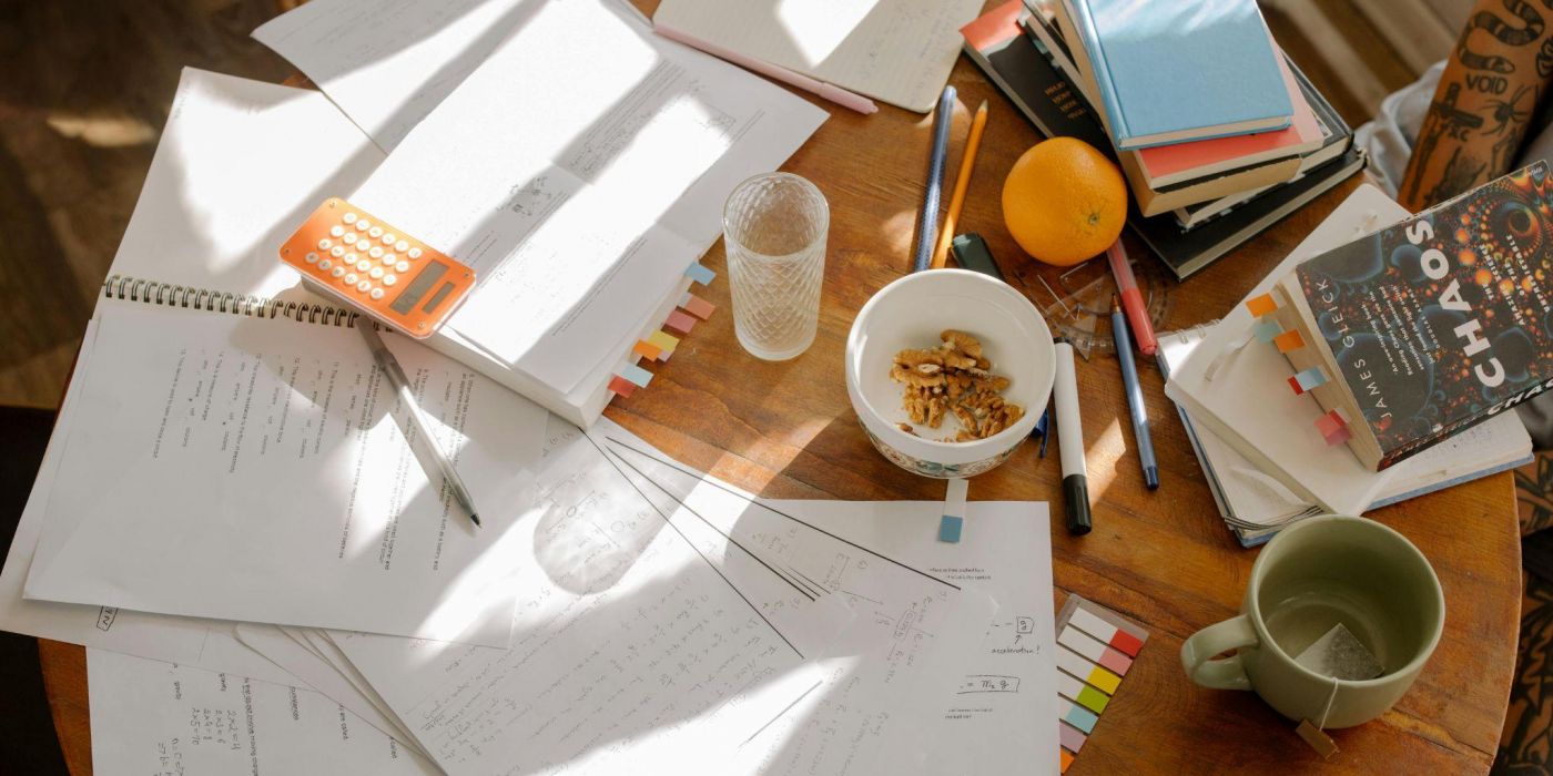 Student study desk with notebooks, calculator, and coffee showcasing focused study space at EVER College Station